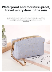 Waterproof blue cosmetic bag with gold star pattern showing water drops on surface