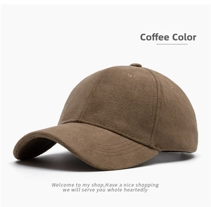 Detailed view of the coffee brown faux suede texture and stitching on the baseball cap