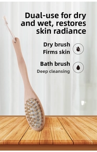 Detail of wooden bath brush with white boar bristles and rubber massage nodes