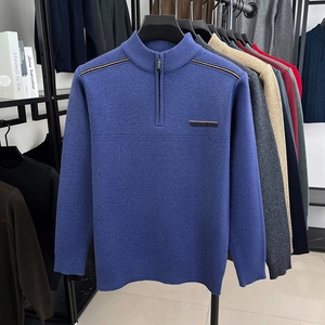 Detail of blue men's quarter-zip sweater with horizontal stripes and ribbed texture