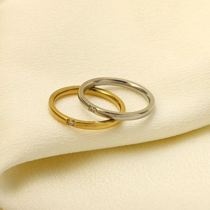 Minimalist 18k gold and silver titanium steel couple rings with small zircon stones