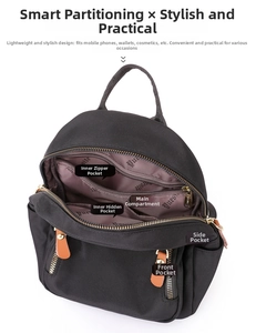 Detail view of the black nylon backpack showing organized internal pockets and lining