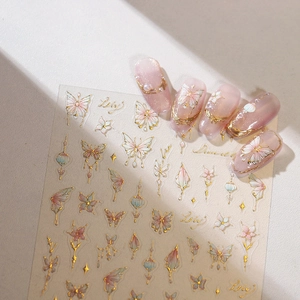 3D bronzing butterfly nail art stickers with pink and mint green floral designs