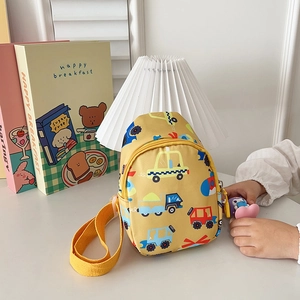 Close-up of yellow children's chest bag with colorful cartoon car prints and zipper