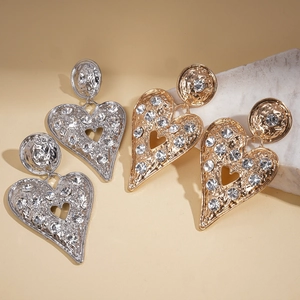 Boucles d'oreilles cœur évidé en métal avec strass brillants en finitions or et argent