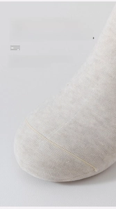 Close-up of seamless toe stitching and breathable cotton texture on solid color socks