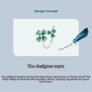 Close-up of green clover open ring with silver finish and white zircon accents