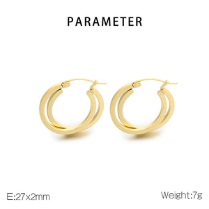 Detail of gold titanium steel hoop earrings with 27x2mm dimensions and 7g weight