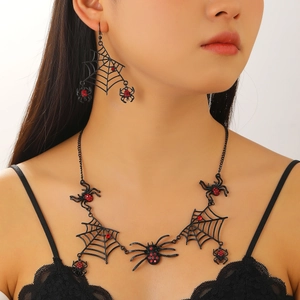 Detail of gothic black spider web necklace set with red rhinestones on a female model