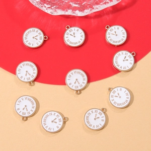 Detailed view of colorful clock enamel charms with gold frames for DIY jewelry
