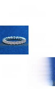 Detailed view of s925 sterling silver moissanite eternity band with classic round stones