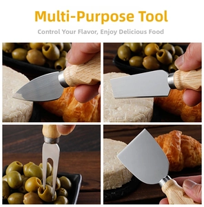 Macro detail of stainless steel cheese knife set slicing brie and olives on a wooden board