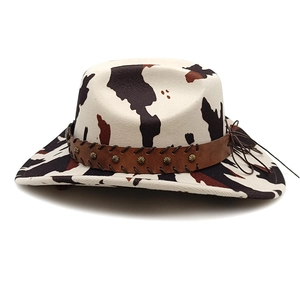 Cow print western cowboy hat with brown leather studded band and metal rivets