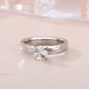 Hammered silver ring for women featuring a four-prong set sparkling zircon on pink base