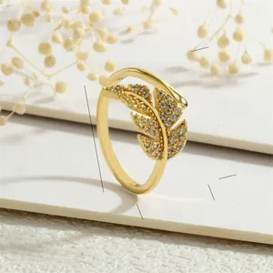 Detailed size chart of vintage brass leaf ring with white zircon stones and 2g weight