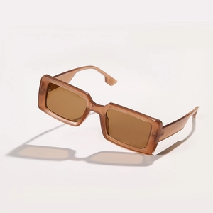 Retro amber tortoiseshell rectangular sunglasses with small frame in a floating perspective