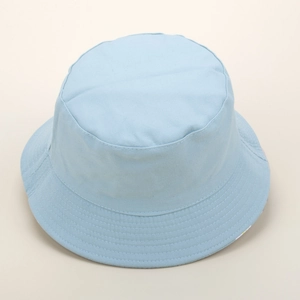 Close-up of light blue bucket hat showing reinforced stitching on the brim and canvas texture