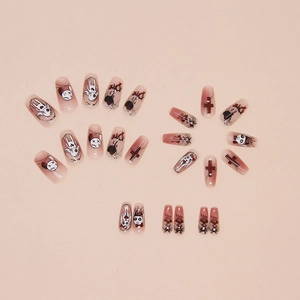 Gothic press-on nails with cartoon rabbit and heart designs on long coffin shapes