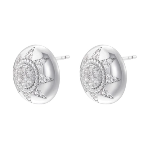 Detailed close-up of silver sunburst stud earrings with micro-pave crystal accents