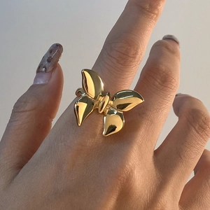 Elegant gold butterfly stainless steel ring showcased on a finger with a glossy finish