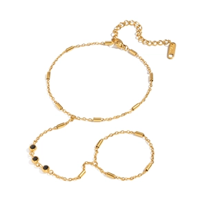 18K gold plated stainless steel finger chain bracelet featuring black zircon accents