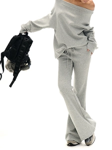Detail of grey lounge set featuring off-shoulder sweatshirt and wide-leg trousers