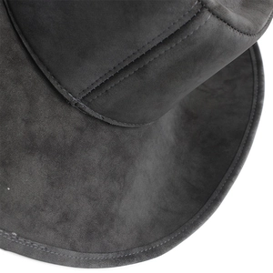Macro detail of high-quality stitching on the dark grey suede cowboy hat material