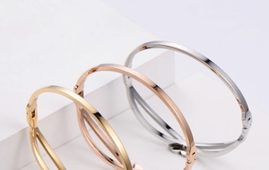 Three-color minimalist titanium steel bangles in gold, rose gold, and silver finishes