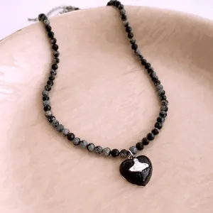 Retro Saturn heart pendant necklace with black and snowflake stone beads for women