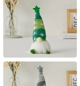 Close-up of green and grey knitted Christmas gnomes with glowing lights and white beards