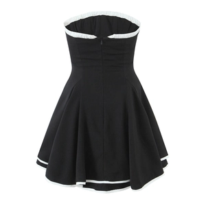Detail view of back with invisible zipper and white trim on black tube dress