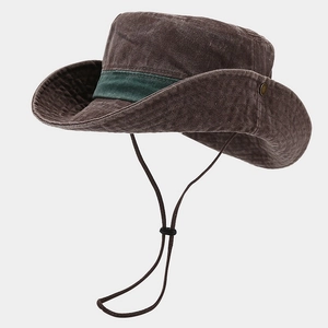 Detail of vintage washed canvas hat showing wide brim, metal vents and green ribbon