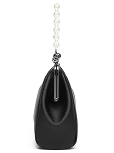 Detail of black PU leather handbag featuring a decorative white pearl handle strap
