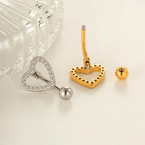 Hollow heart belly button ring with pavé cubic zirconia in silver and gold metal finish