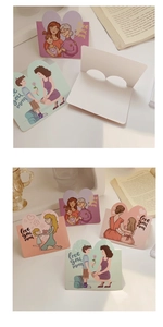 Detailed view of standing Mother's Day cards with heart cutout and Love you mom text