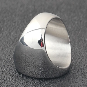 Polished silver stainless steel wide band ring with a smooth 45-degree side view