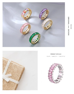 Detail of colorful rhinestone eternity rings in gold and silver settings with gift box