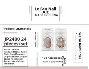 Detail view of 24pcs matte black and gold star nail set including 1g glue accessory