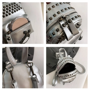 Detail of mini silver backpack featuring metallic PU leather, rivets and cross chain detail