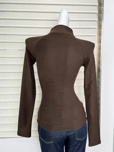 Rear view of brown slim-fit long-sleeve thermal top with high collar and zipper detail