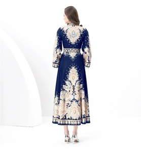 Detail of vintage court style paisley print dress with stand collar and flared hem