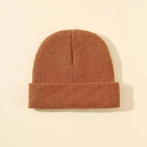 Close-up of caramel brown ribbed knit beanie with cuffed design for winter warmth