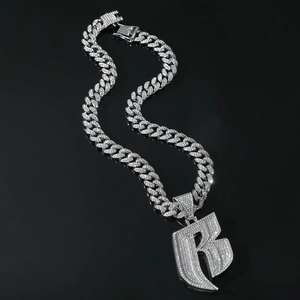 Silver iced out letter R pendant with Cuban link chain for men in hip hop style