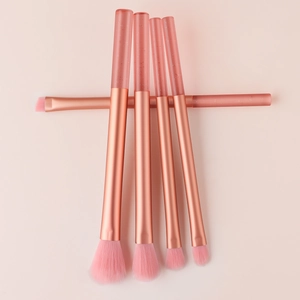 Detailed view of 5-piece mini makeup brushes with pink crystal glitter handles