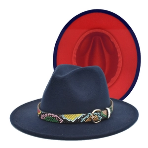 Detail of navy blue felt fedora hat featuring red brim lining and snakeskin band buckle