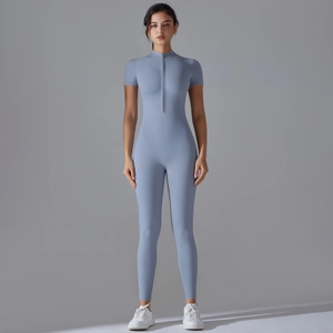 Close-up of the front half-zipper design on a slim-fit short sleeve sports bodysuit