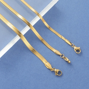 Detail of three different widths of gold stainless steel flat snake chains with lobster clasps