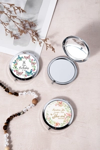 Detail of chrome folding makeup mirror with birthday wishes and floral printed patterns