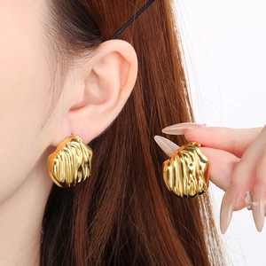 Irregular molten texture gold earrings in stainless steel with a high-shine finish