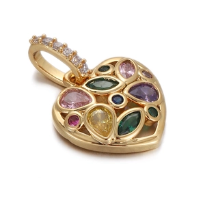 Detailed view of a gold heart charm pendant inlaid with colorful zircon gemstones